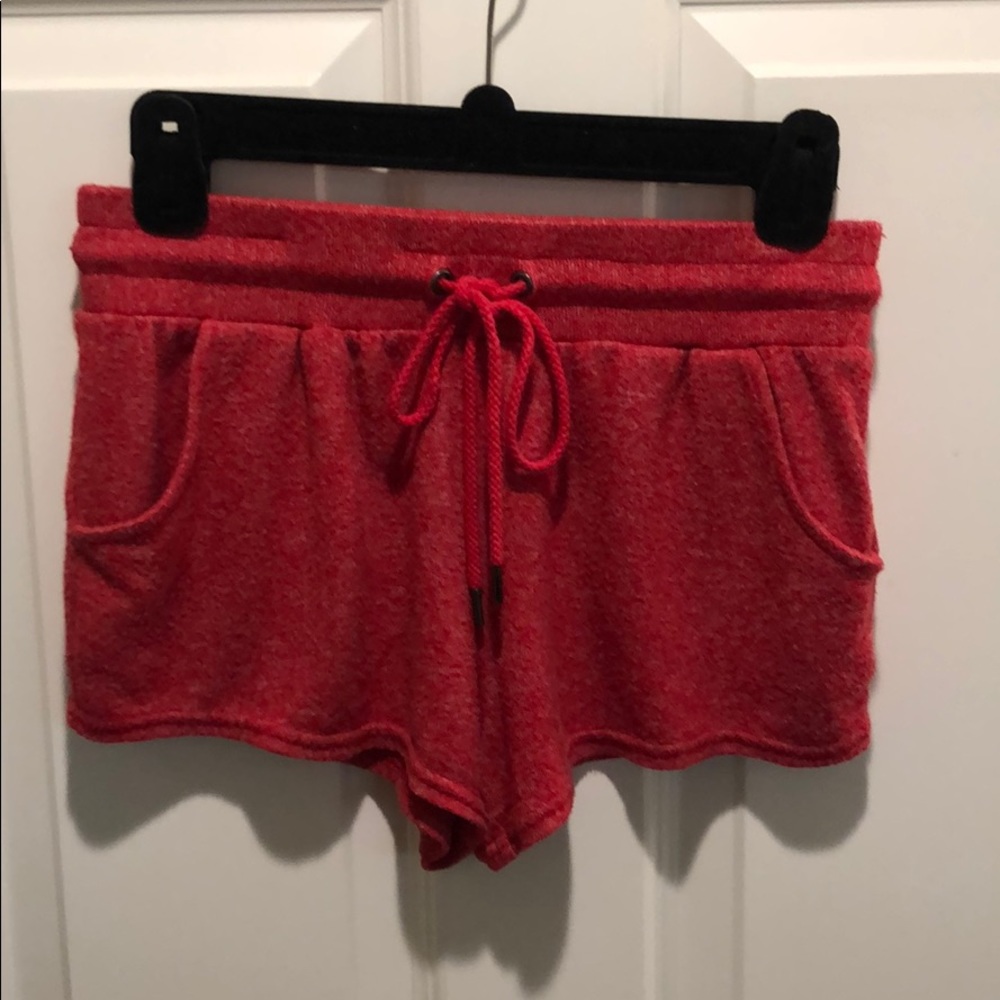 Out from under red shorts